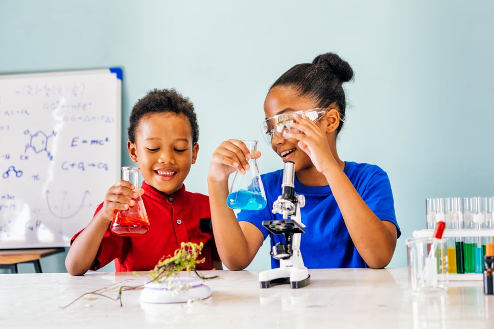 Two African American Mixed Kids Testing Chemistry Lab Experiment