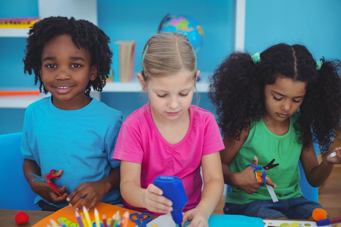 Happy kids doing arts and crafts together