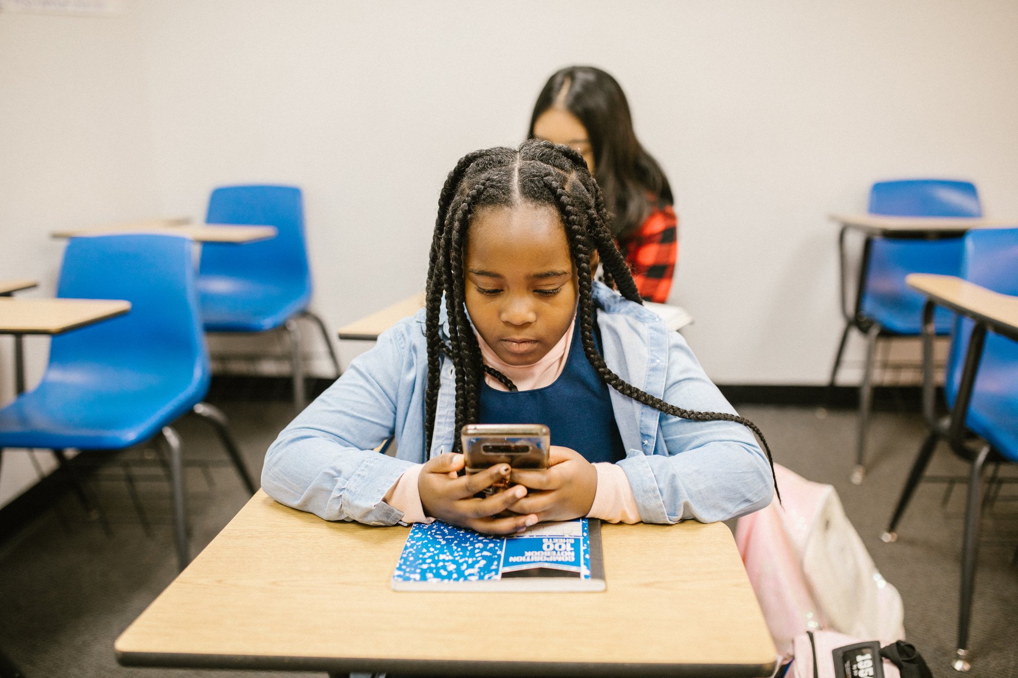 Girl Using Her Phone in School 